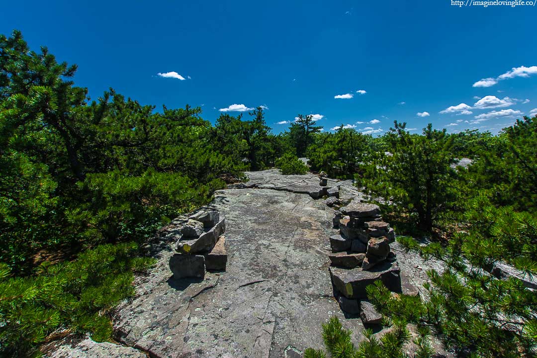 cairns in yellow trail